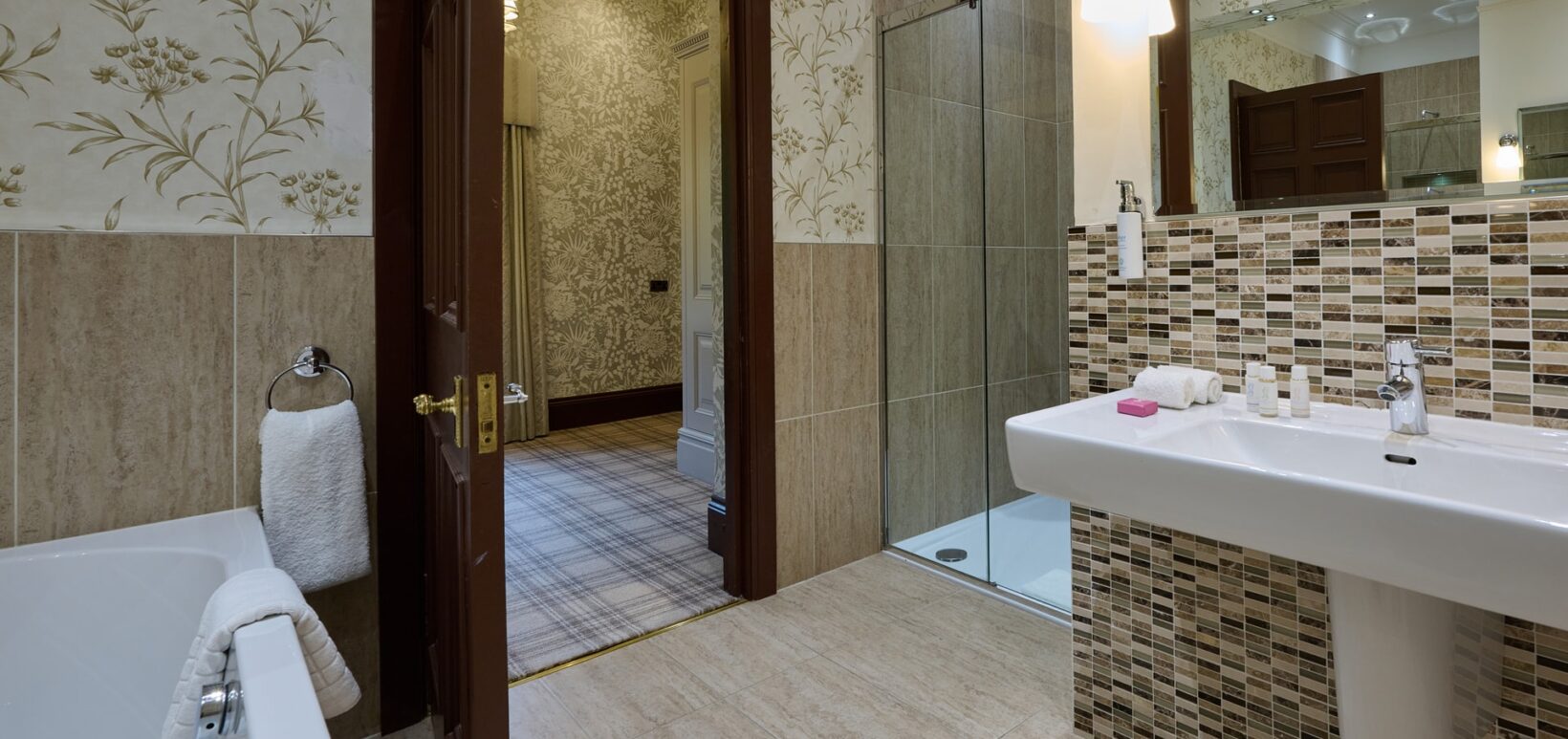 Ensuite Bathroom with separate bathtub and shower